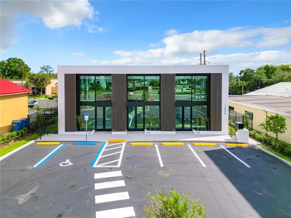 a view of a building with a yard