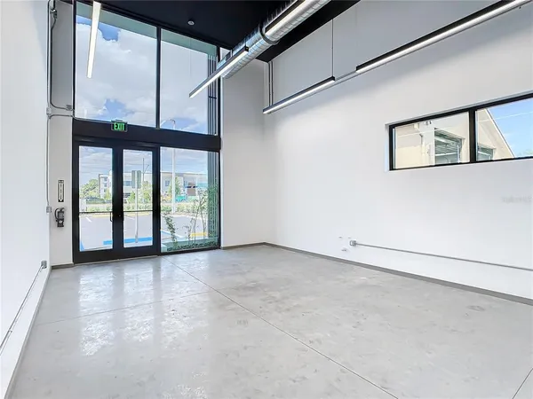 a view of an empty room with a window