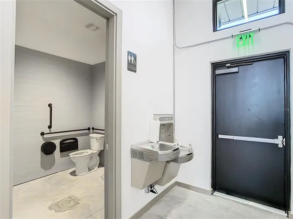 a view of storage and utility room with a sink