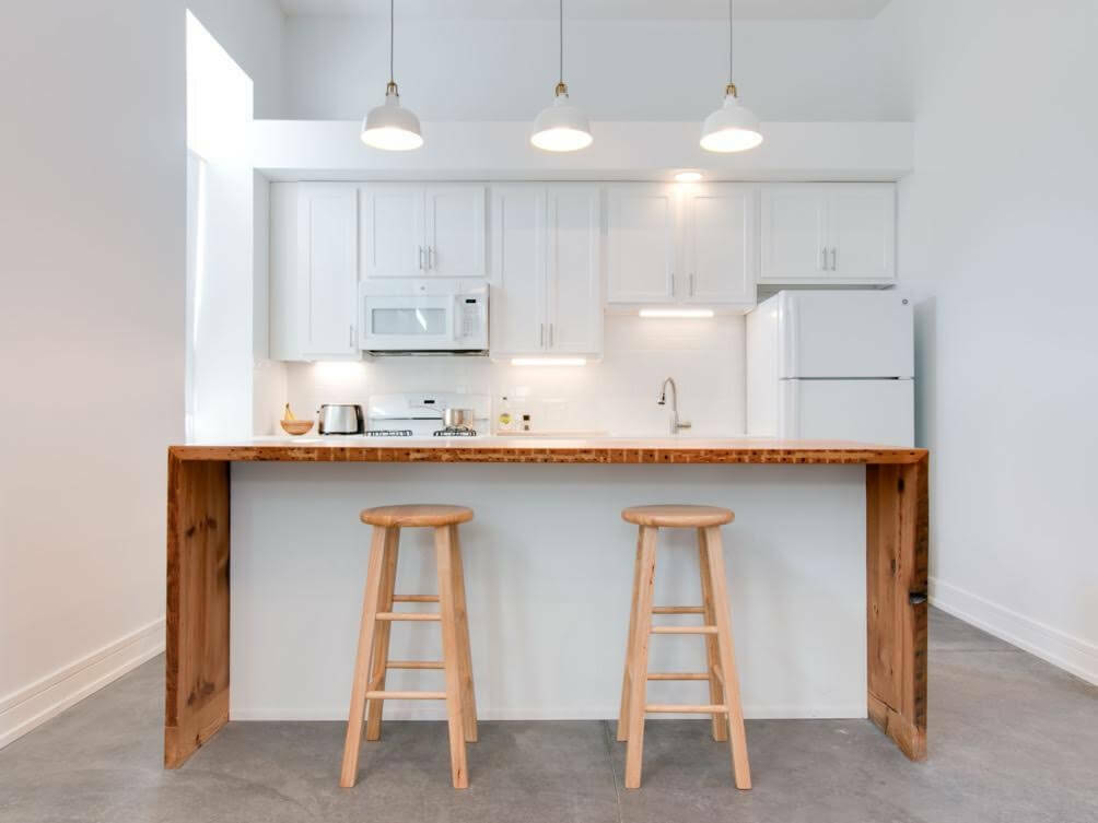 1157 West 18th Street Chicago, IL 60608 - Photo 4 of 8 a kitchen with a sink cabinets and window