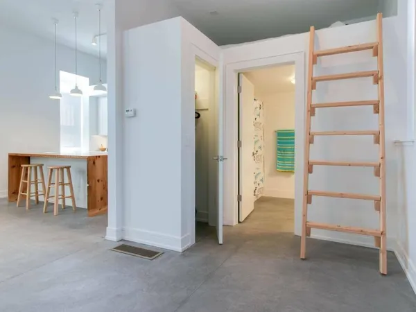 a view of an empty room with a closet