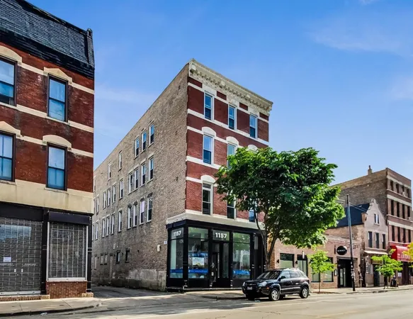 a front view of a building and a street