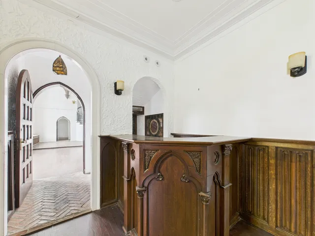 an empty room with wooden floor