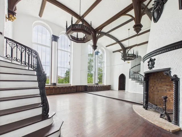 a view of entryway with a window and wooden floor