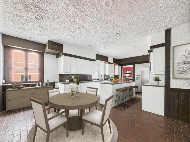a kitchen with stainless steel appliances granite countertop a sink and a refrigerator