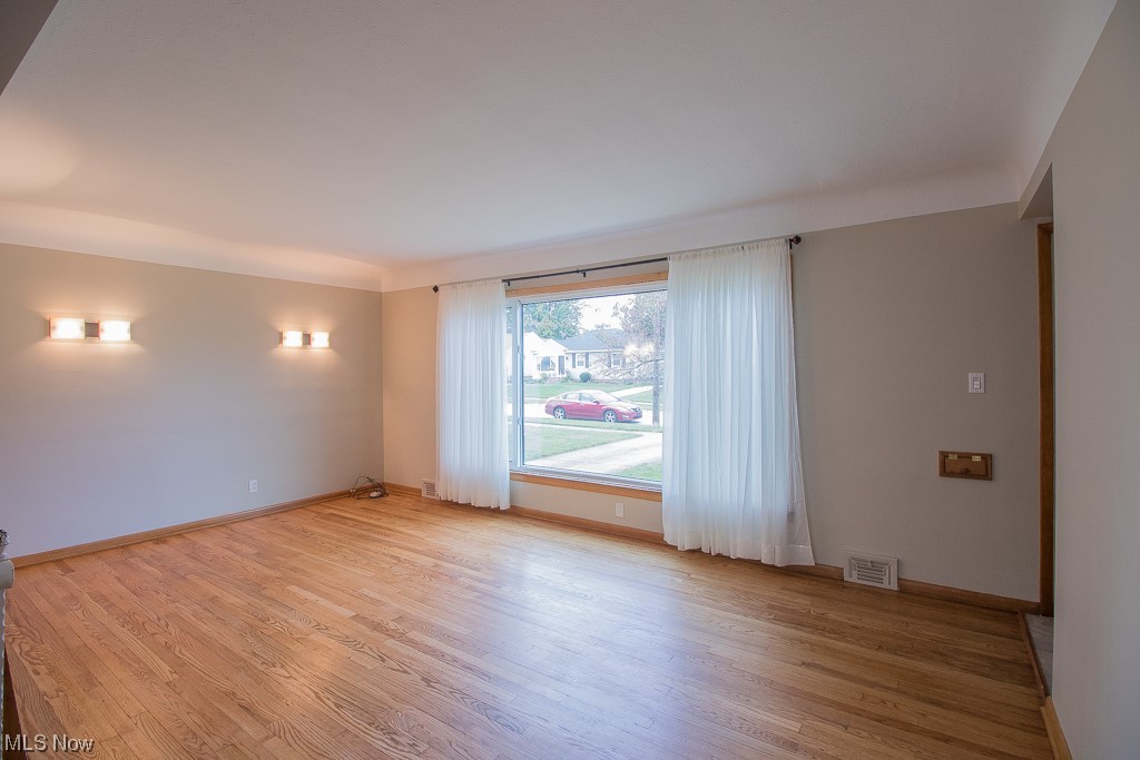 1329 West Miner Road Mayfield Heights, OH 44124 - Photo 5 of 21 Freshly painted Living Room with beautiful hardwood floor.