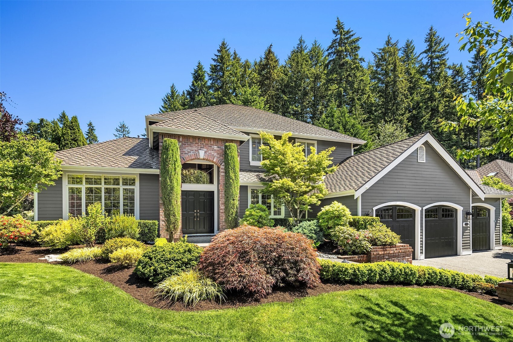 21505 30th Avenue Southeast Bothell, WA 98021 - Photo 1 of 40 a front view of a house with a yard