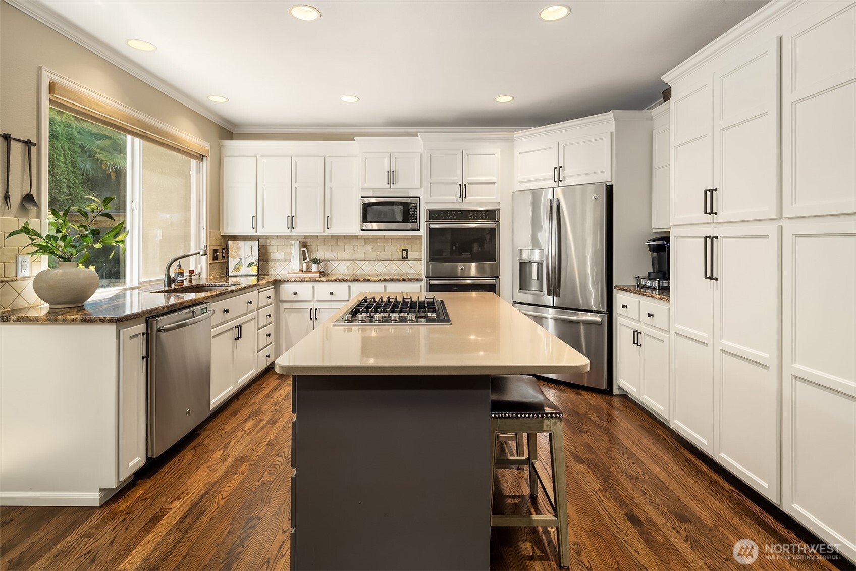 21505 30th Avenue Southeast Bothell, WA 98021 - Photo 14 of 40 a kitchen with stainless steel appliances a sink a stove a refrigerator and cabinets