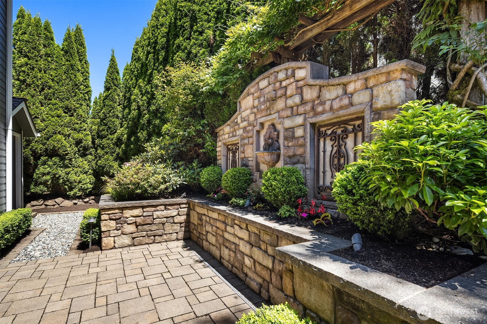 21505 30th Avenue Southeast Bothell, WA 98021 - Photo 30 of 40 a view of a pathway with a potted plants