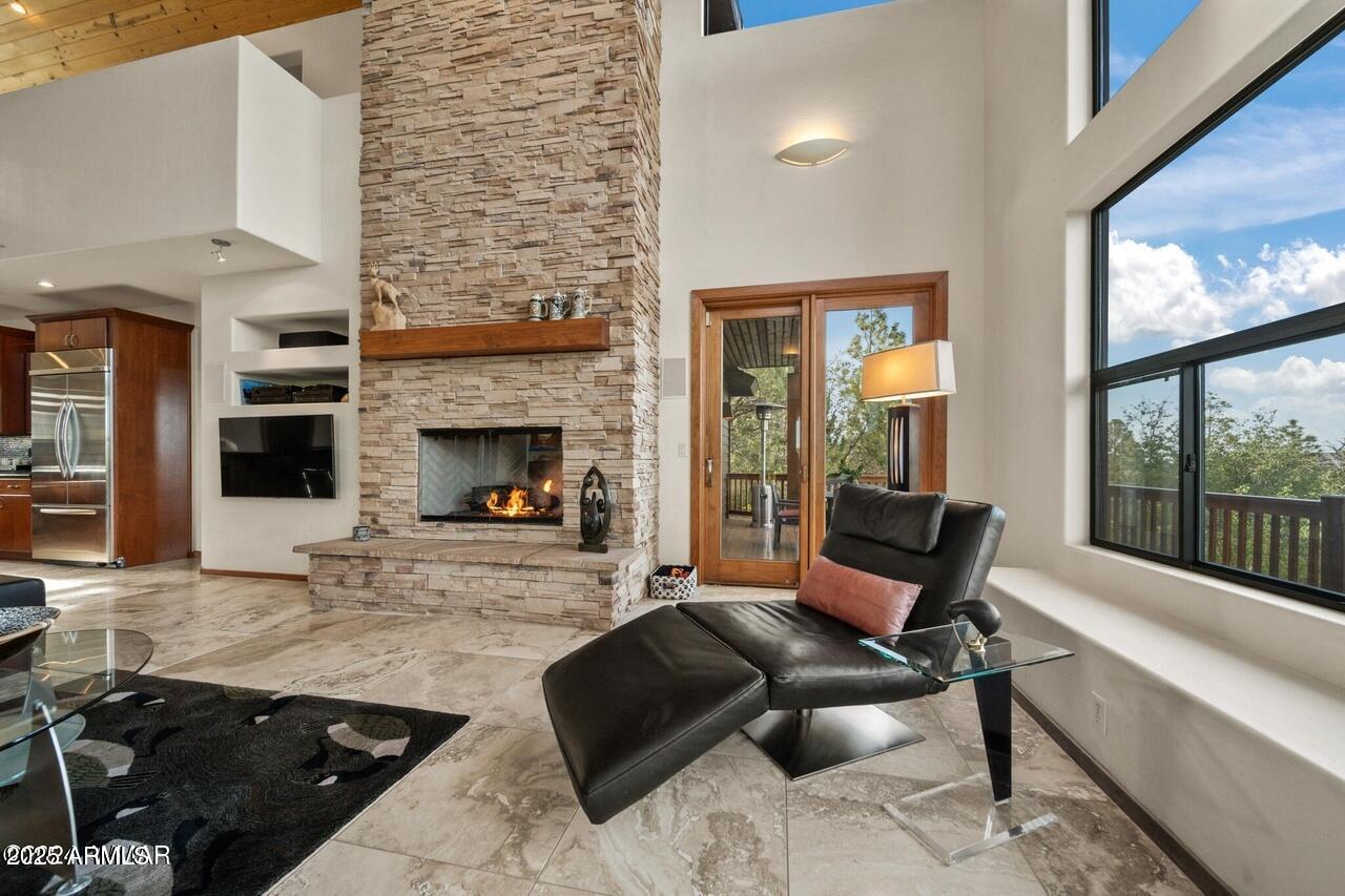 3180 Snowberry Loop Show Low, AZ 85901 - Photo 16 of 101 a living room with furniture and a fireplace