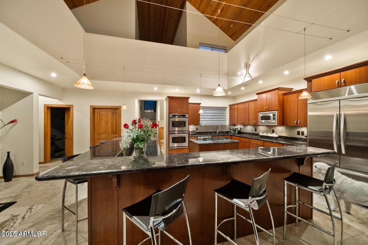 3180 Snowberry Loop Show Low, AZ 85901 - Photo 42 of 101 a kitchen with a table and chairs in it