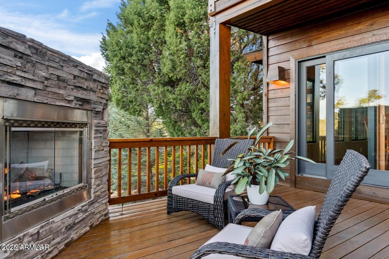3180 Snowberry Loop Show Low, AZ 85901 - Photo 60 of 101 a outdoor living room with furniture and a fireplace