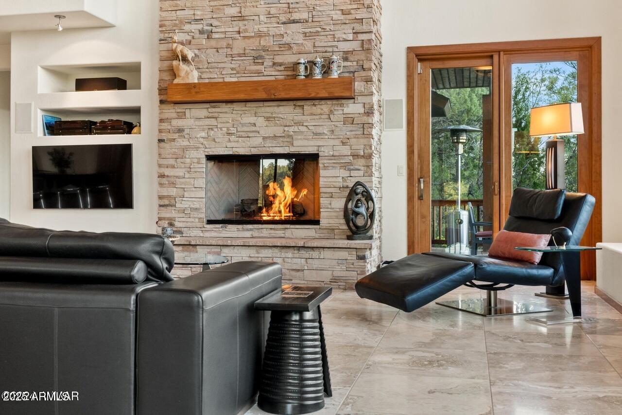 3180 Snowberry Loop Show Low, AZ 85901 - Photo 61 of 101 a living room with furniture and a fireplace