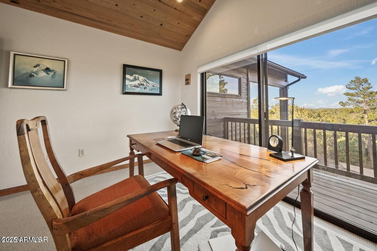 3180 Snowberry Loop Show Low, AZ 85901 - Photo 77 of 101 a view of a workspace with furniture and a table