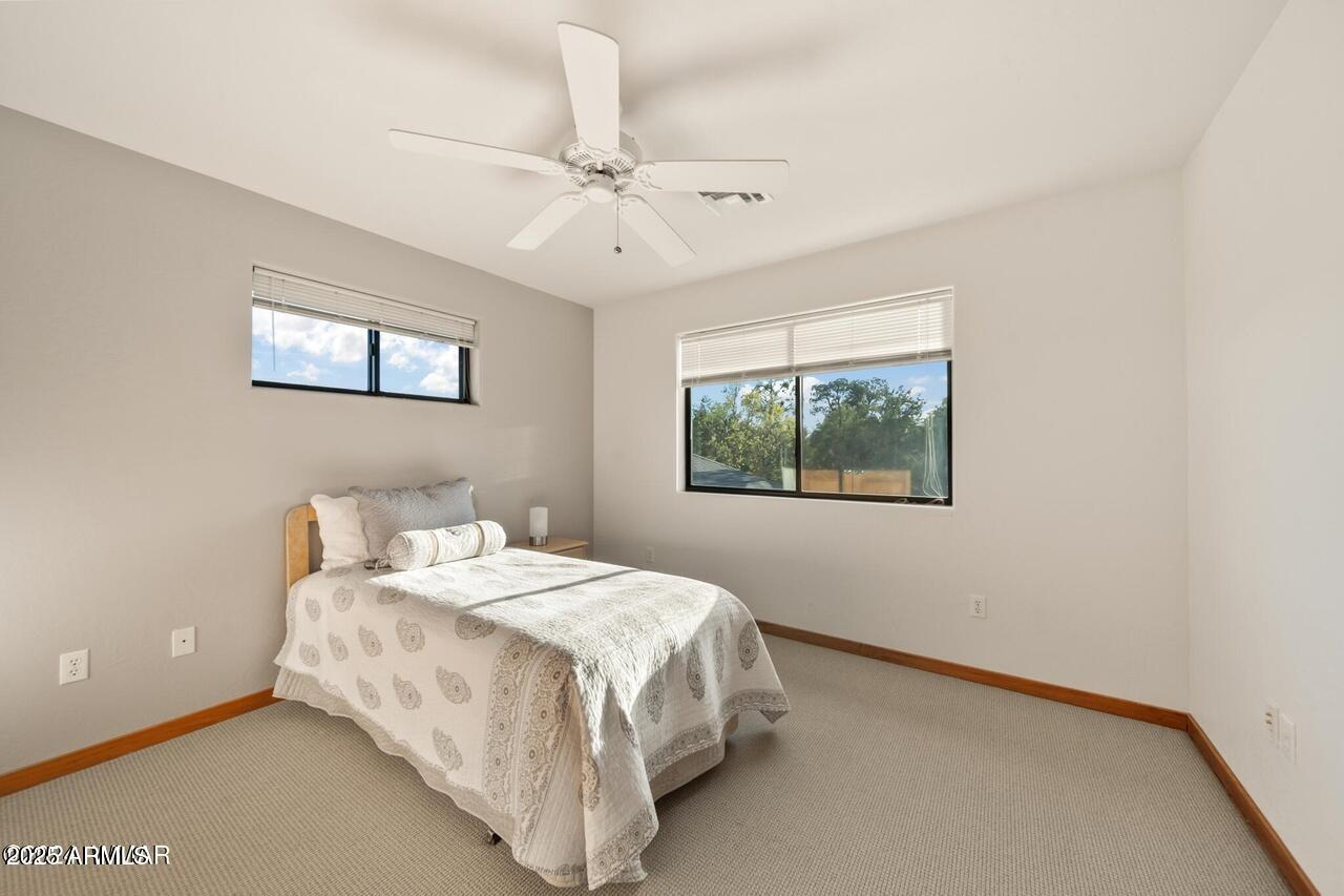 3180 Snowberry Loop Show Low, AZ 85901 - Photo 79 of 101 a bedroom with a bed and a window