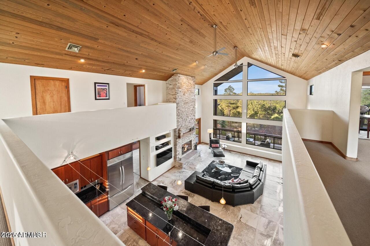 3180 Snowberry Loop Show Low, AZ 85901 - Photo 80 of 101 a livingroom with furniture and a floor to ceiling window