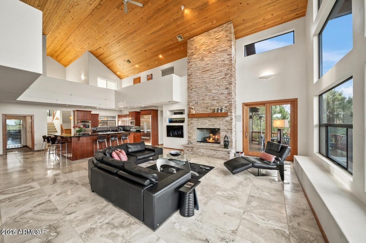 3180 Snowberry Loop Show Low, AZ 85901 - Photo 10 of 101 a living room with fireplace furniture and a large window