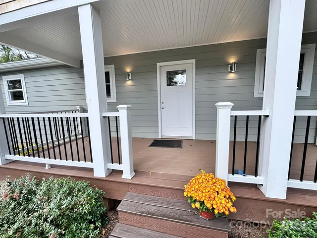 a kitchen with sink refrigerator and window