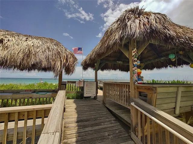 a view of a swimming pool with a bench