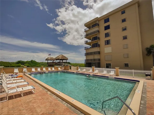 a view of a swimming pool with a lake view