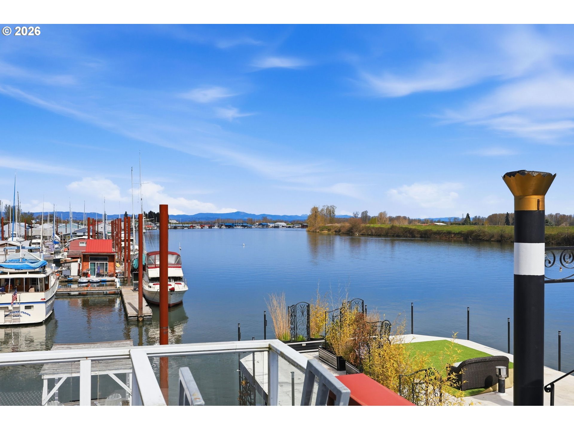 34326 Johnson's Landing Road, Unit C27 Scappoose, OR 97056 - Photo 26 of 38 a view of a lake from a balcony