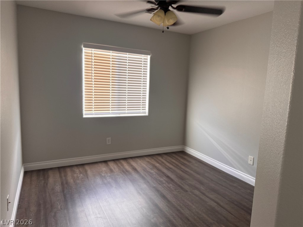 8937 Austin Ridge Avenue Las Vegas, NV 89178 - Photo 3 of 22 A well-proportioned bedroom showcases rich wood flooring and a ceiling fan for optimal comfort.