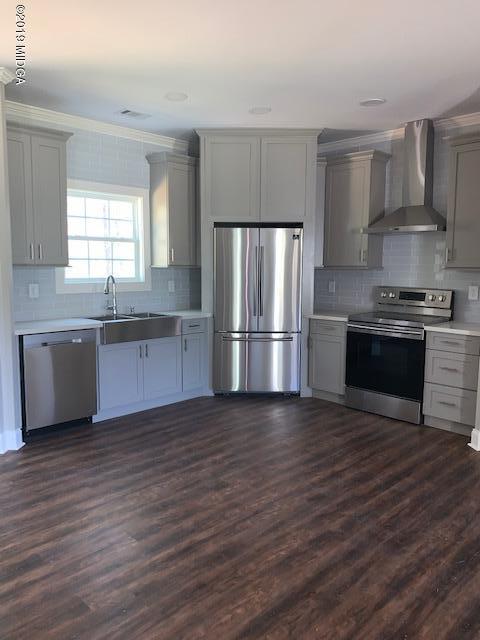 246 Ridge Point Way Macon, GA 31220 - Photo 2 of 8 a kitchen with stainless steel appliances granite countertop a refrigerator stove top oven and sink