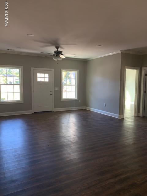 246 Ridge Point Way Macon, GA 31220 - Photo 3 of 8 an empty room with hard wood floors and windows