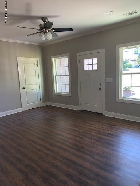 246 Ridge Point Way Macon, GA 31220 - Photo 4 of 8 a view of an empty room with wooden floor and a window