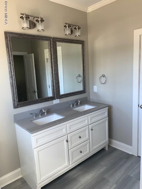 246 Ridge Point Way Macon, GA 31220 - Photo 7 of 8 a bathroom with a double vanity sink and a mirror