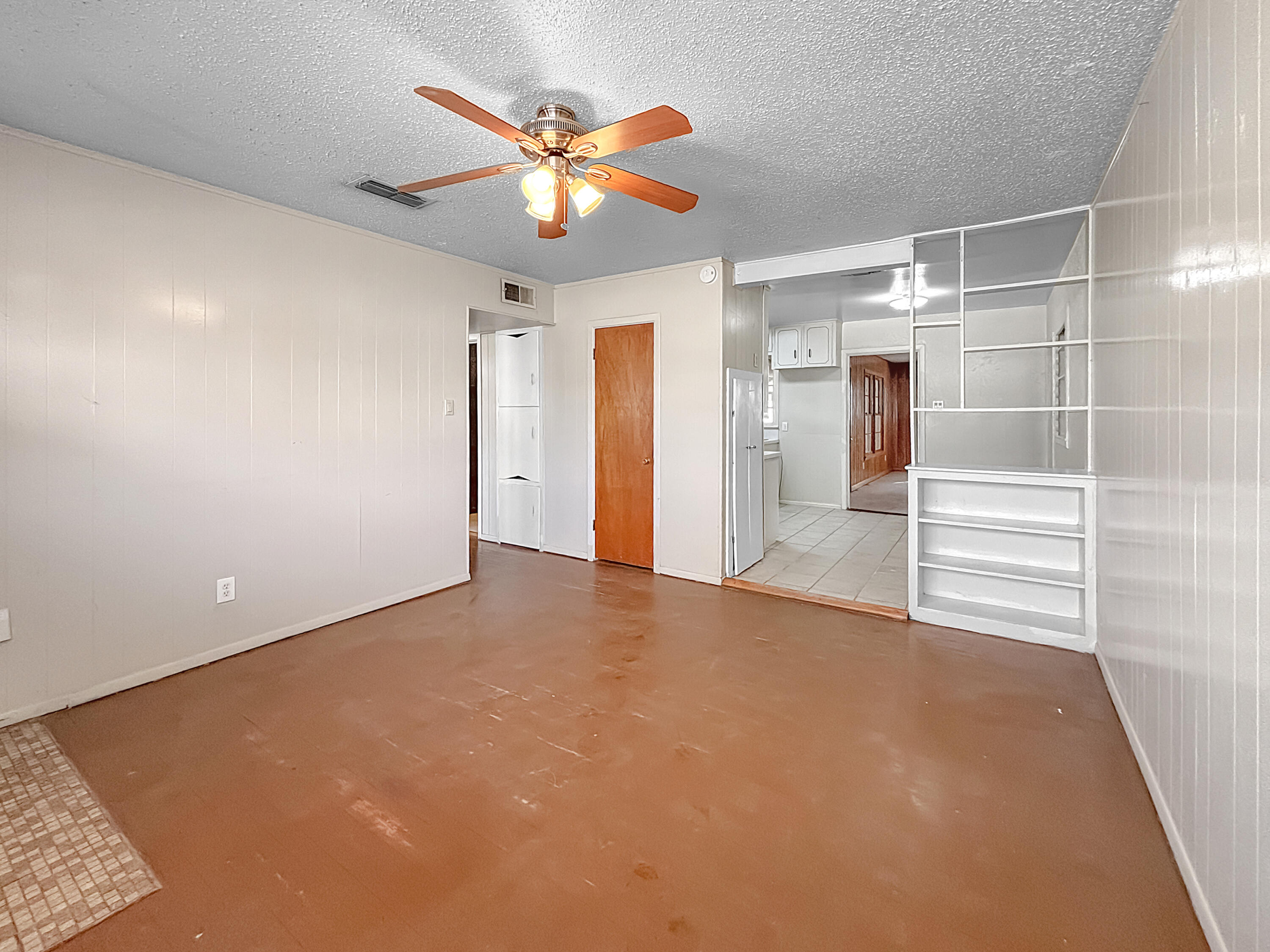 4411 45th Street Lubbock, TX 79414 - Photo 36 of 44 an empty room with chandelier fan and windows