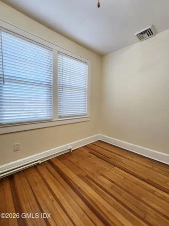 a utility room with cabinets washer and dryer