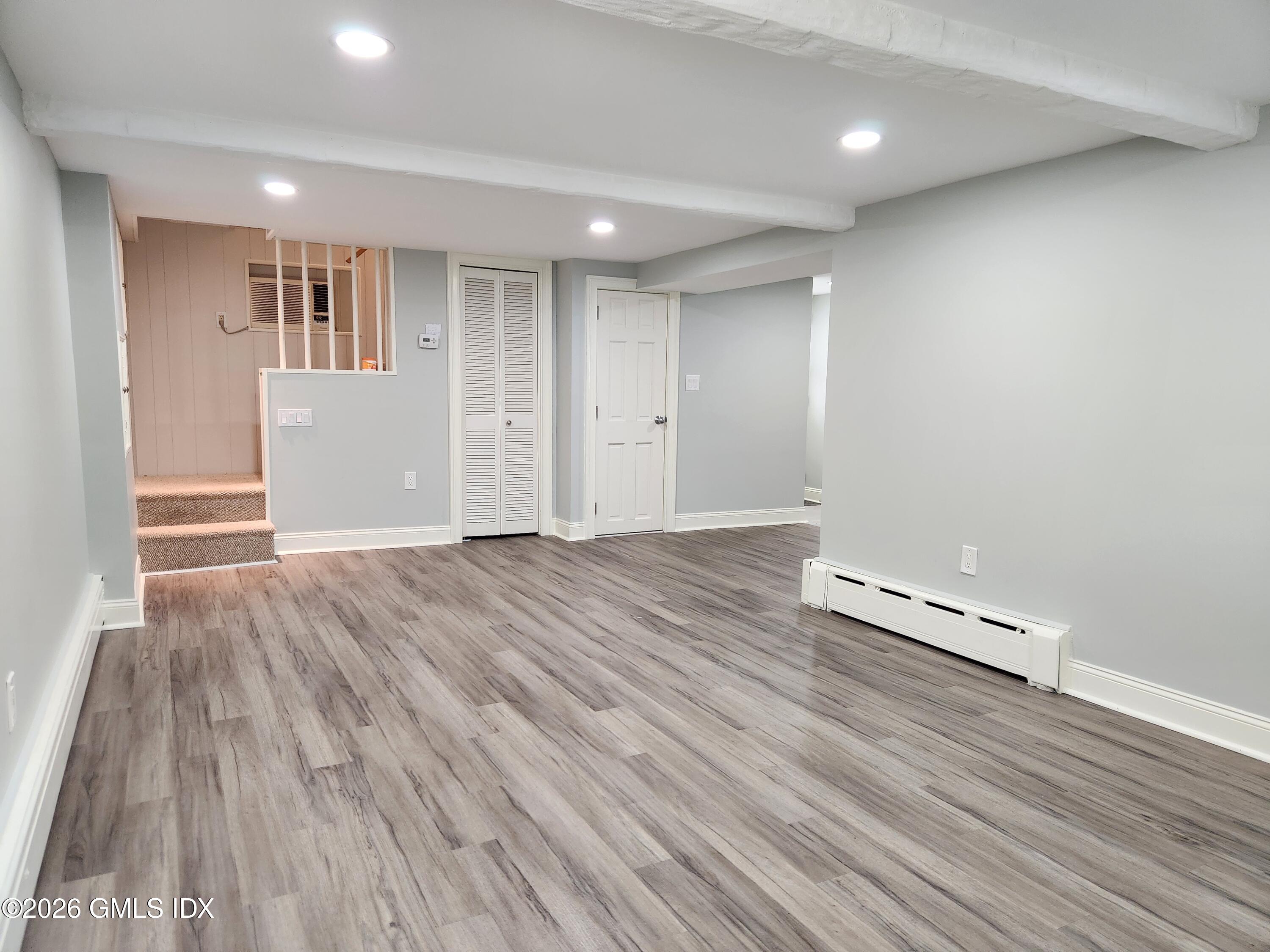 34 Harold Street Cos Cob, CT 06807 - Photo 18 of 25 an empty room with wooden floor and windows