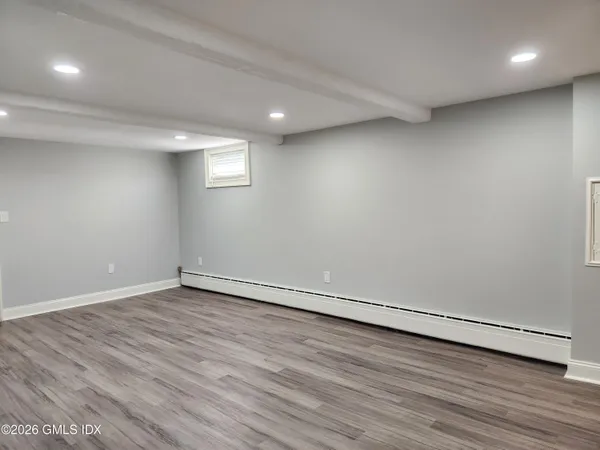 a view of a swimming pool with an outdoor seating