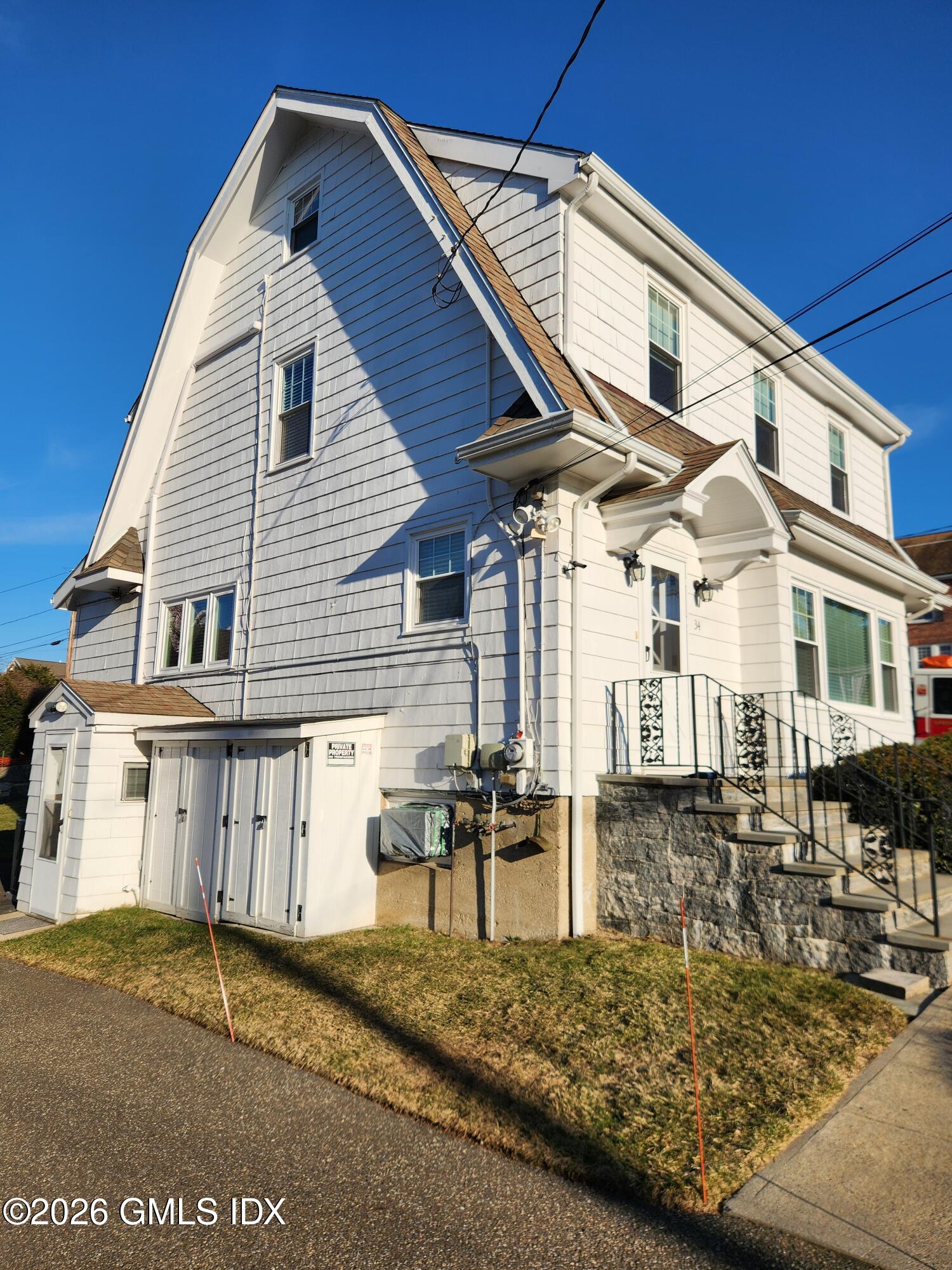 34 Harold Street Cos Cob, CT 06807 - Photo 2 of 25 a front view of a house with garden