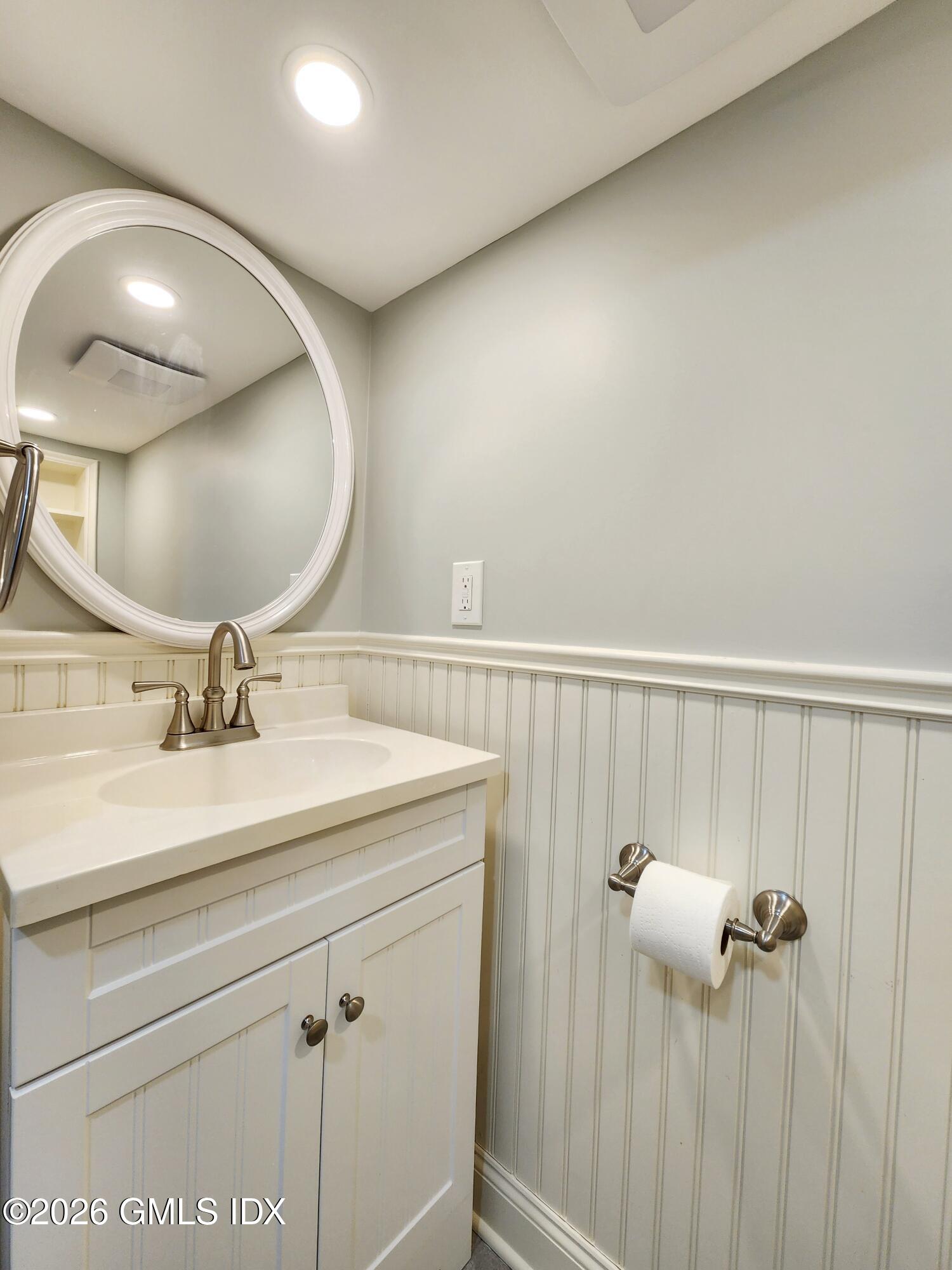 34 Harold Street Cos Cob, CT 06807 - Photo 21 of 25 a bathroom with a sink and a mirror