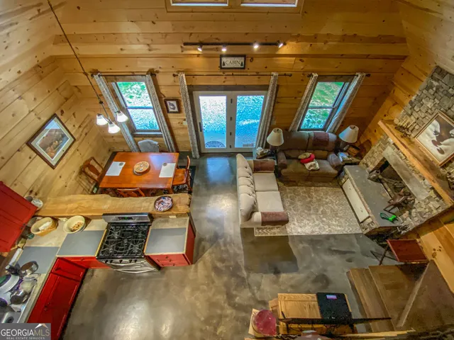 a view of a livingroom with furniture and windows