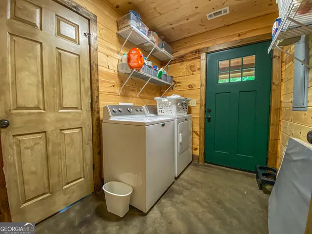 a bed room with a bed and a ceiling fan