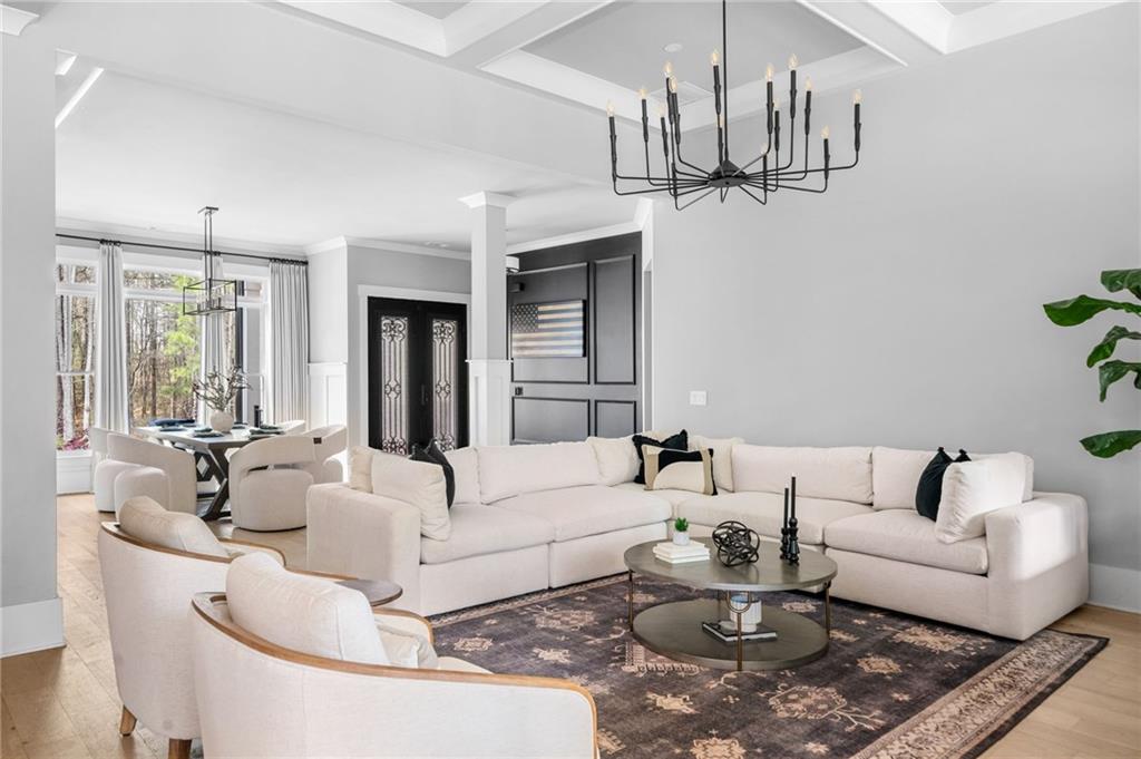 8215 Highway 81 Bethlehem, GA 30620 - Photo 11 of 60 a living room with furniture a chandelier and kitchen view