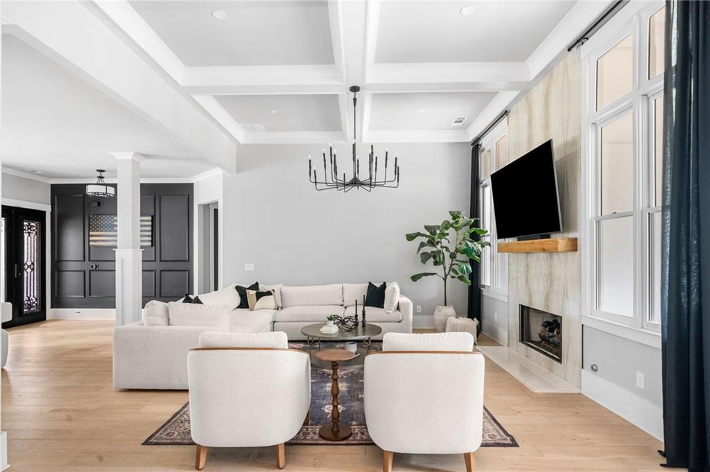 8215 Highway 81 Bethlehem, GA 30620 - Photo 12 of 60 a living room with fireplace furniture and a flat screen tv