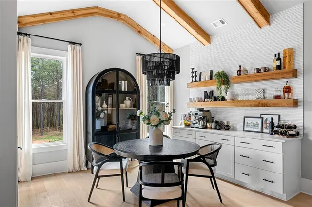 a bedroom with furniture and a window