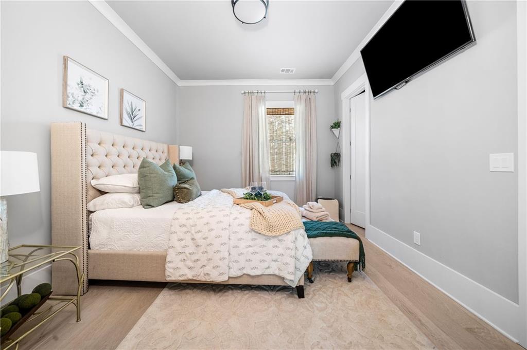 8215 Highway 81 Bethlehem, GA 30620 - Photo 23 of 60 a bedroom with a bed a couch and a window