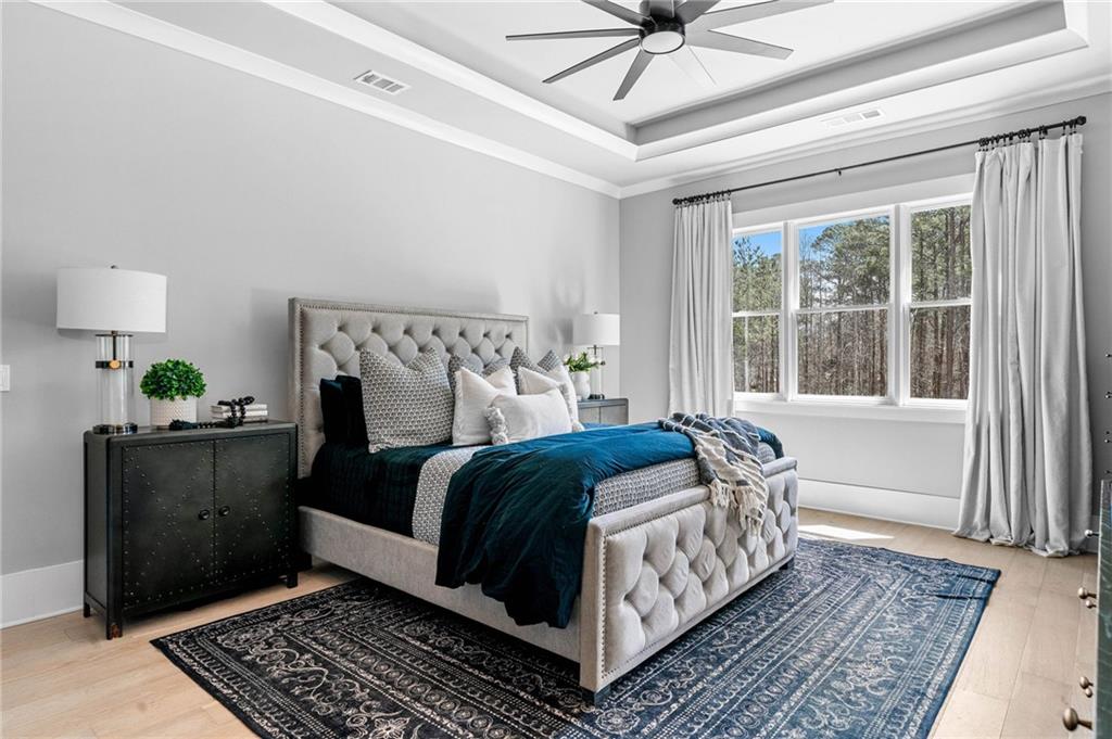 8215 Highway 81 Bethlehem, GA 30620 - Photo 25 of 60 a bed sitting in a bedroom next to a window