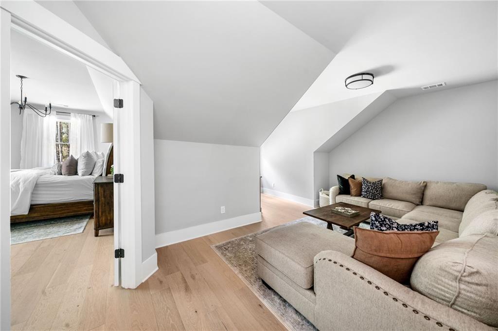 8215 Highway 81 Bethlehem, GA 30620 - Photo 34 of 60 a living room with furniture and a wooden floor