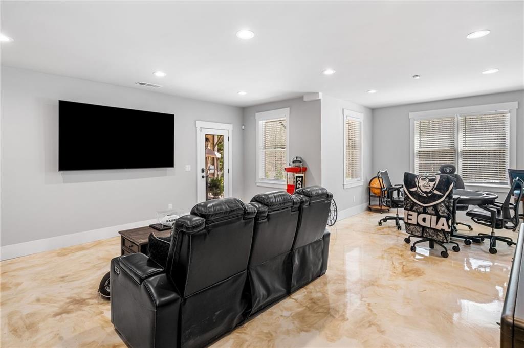 8215 Highway 81 Bethlehem, GA 30620 - Photo 38 of 60 a living room with furniture and a flat screen tv