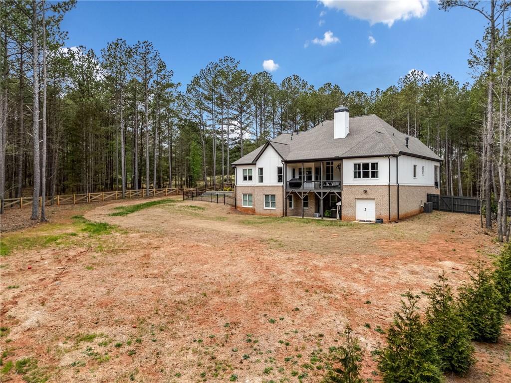 8215 Highway 81 Bethlehem, GA 30620 - Photo 44 of 57 a view of a house with a yard