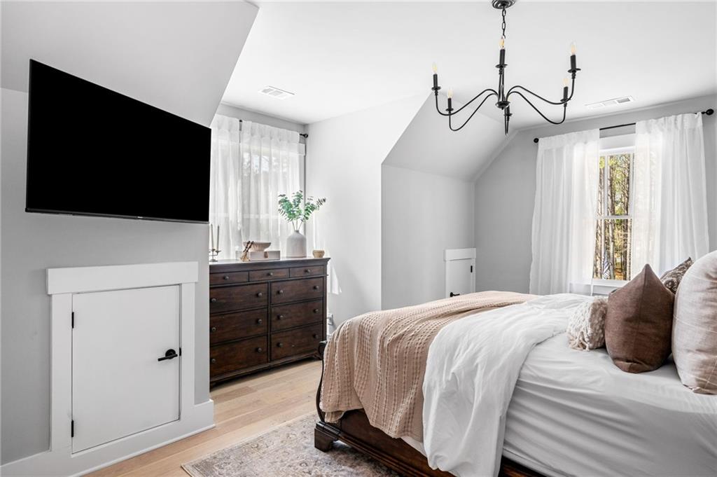 8215 Highway 81 Bethlehem, GA 30620 - Photo 44 of 60 a bedroom with a bed and a flat tv screen on dresser