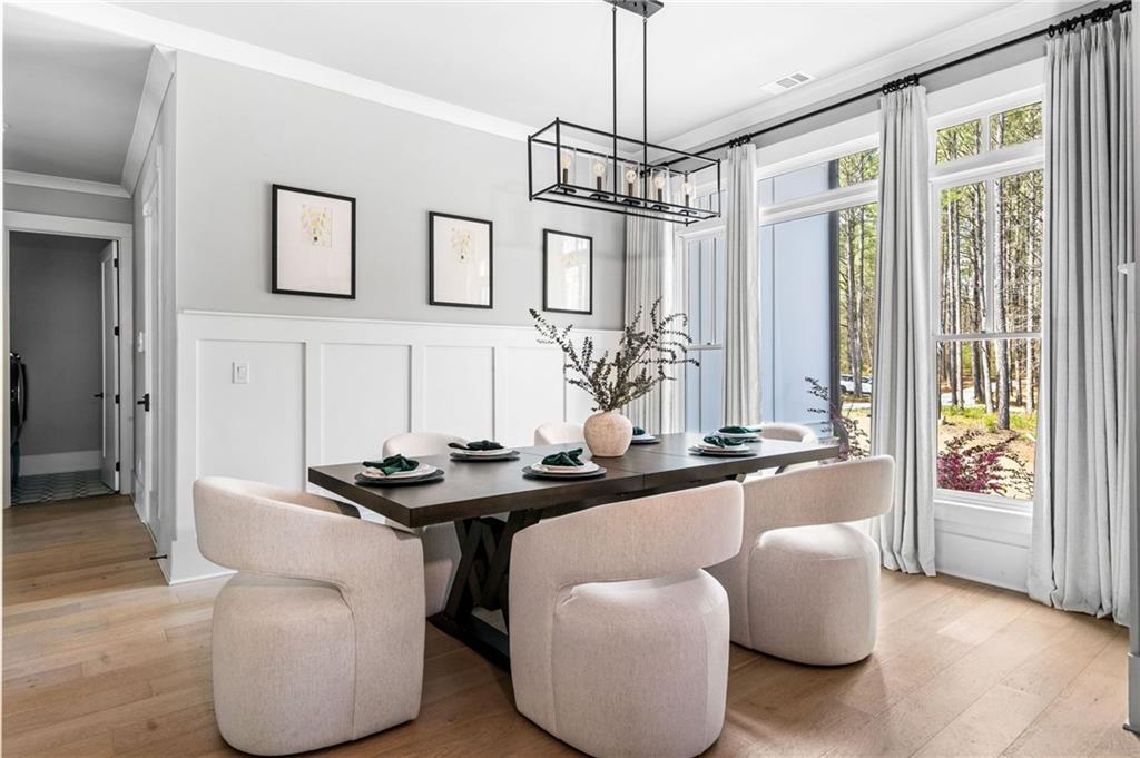 8215 Highway 81 Bethlehem, GA 30620 - Photo 6 of 60 a dining room with furniture and a chandelier