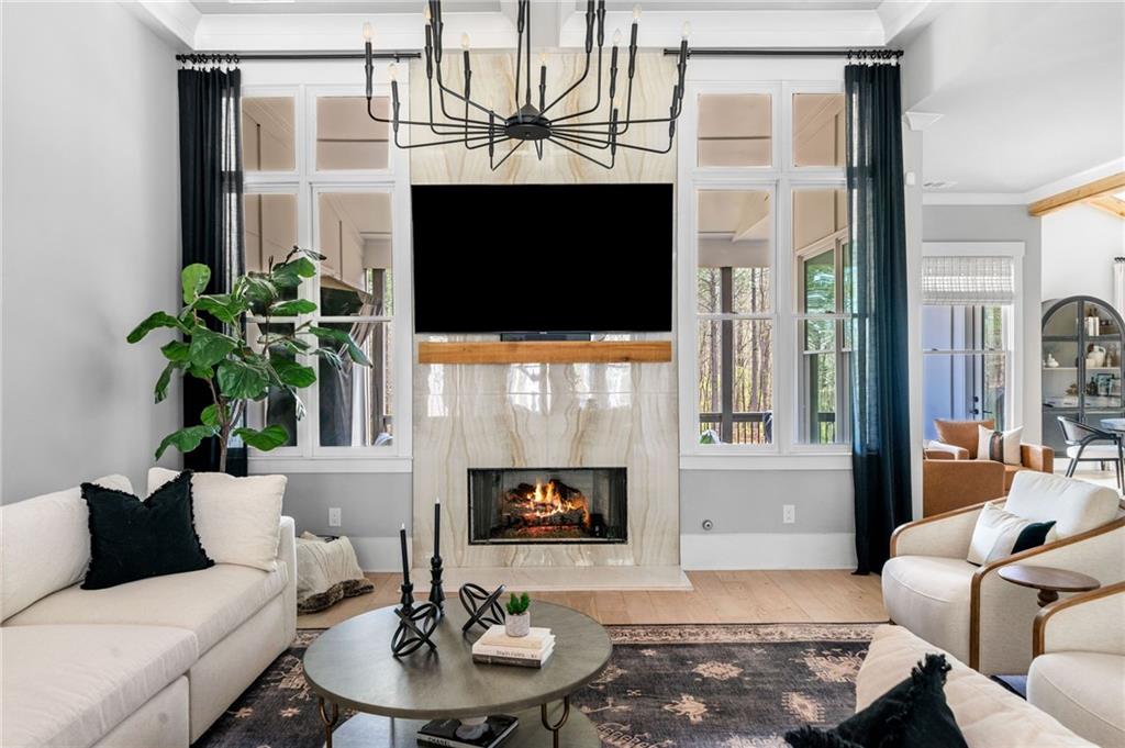 8215 Highway 81 Bethlehem, GA 30620 - Photo 8 of 60 a living room with furniture a fireplace and a potted plant