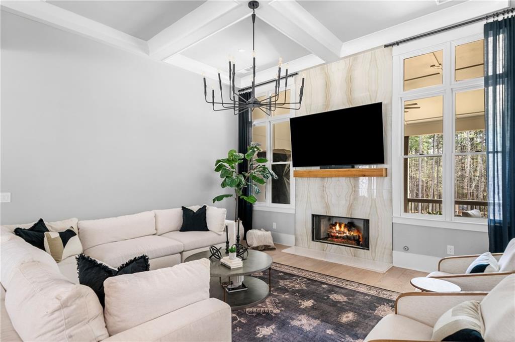 8215 Highway 81 Bethlehem, GA 30620 - Photo 10 of 60 a living room with furniture a fireplace and a flat screen tv